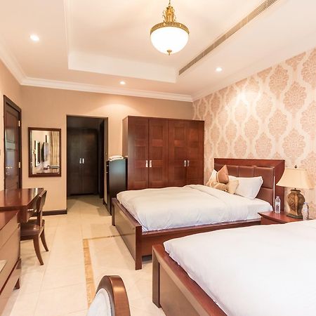 Yanjoon Holiday Homes - Palm Jumeirah Frond A Villas دبي المظهر الخارجي الصورة
